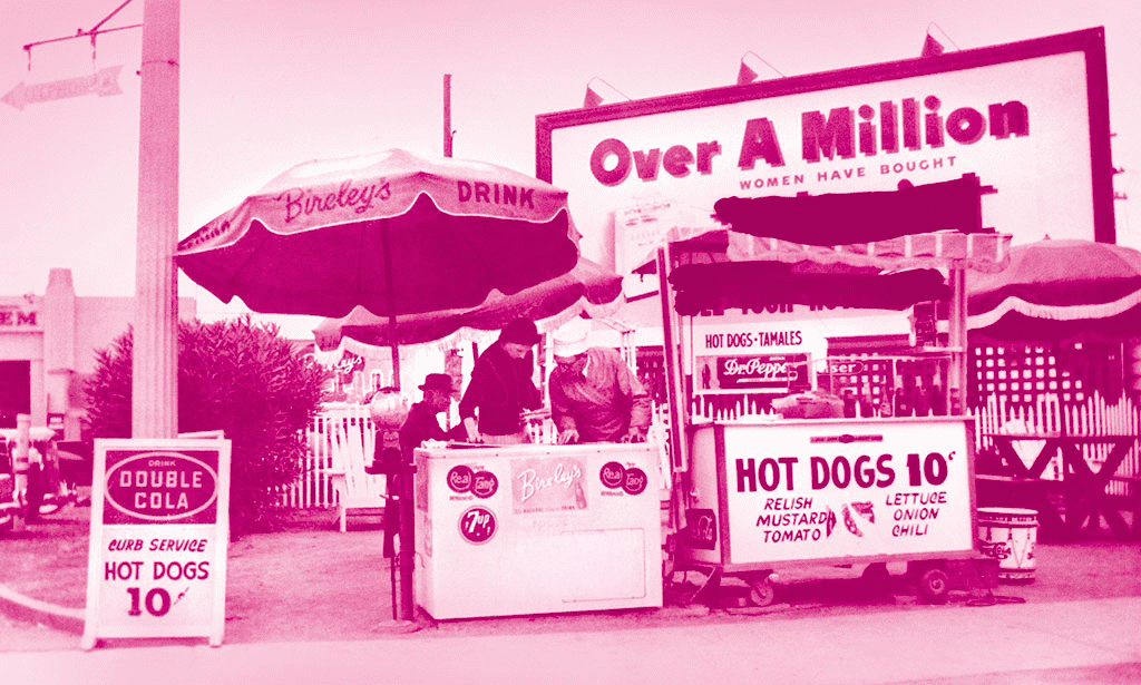 Photo of Pink's hot dog stand from 1939 with a pink hue filter
